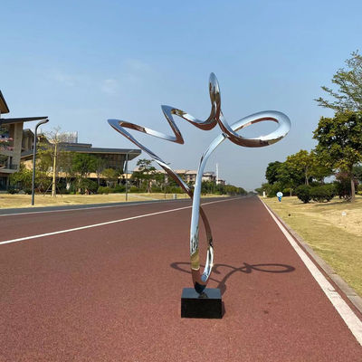 Bom preço. Escultura decorativa de fita polida de aço inoxidável com base de pedra preta on-line